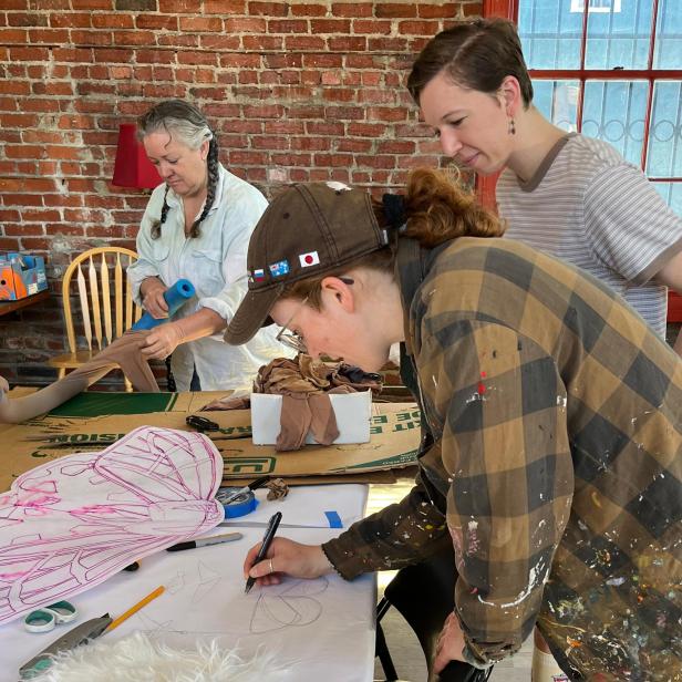 Earthly Procession L to R Spring Maxfield Alina Nuebel Natalie Gospe work on parade art designs